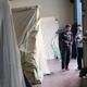 Residents at Sinatex camp charge lanterns and run power into their tents.